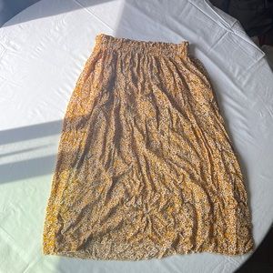 a yellow cotton floral skirt